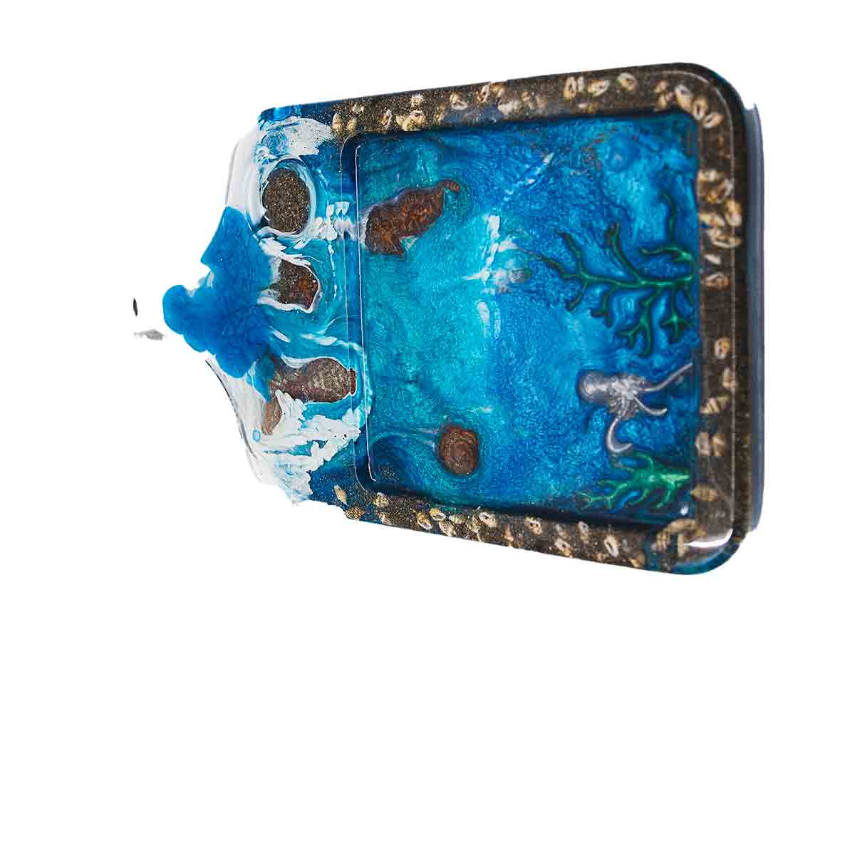 Cheese board with an ocean theme including sea life, made out of resin.