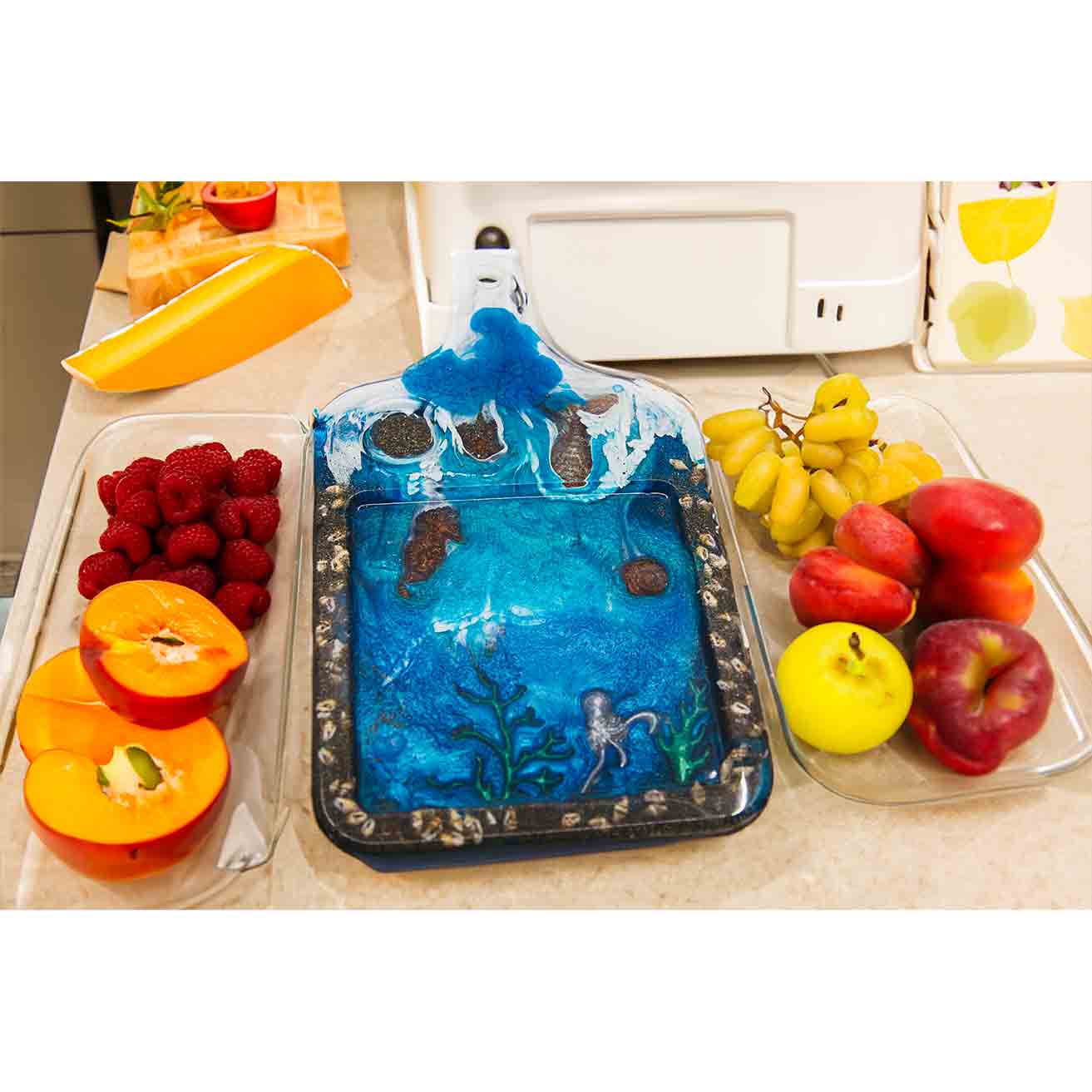 Cheese board made out of resin featuring sea life.