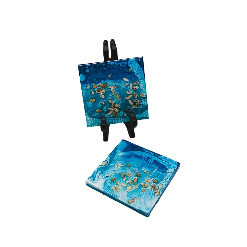 Four inch square resin coaster. Ocean themed with real shells embedded in the resin.