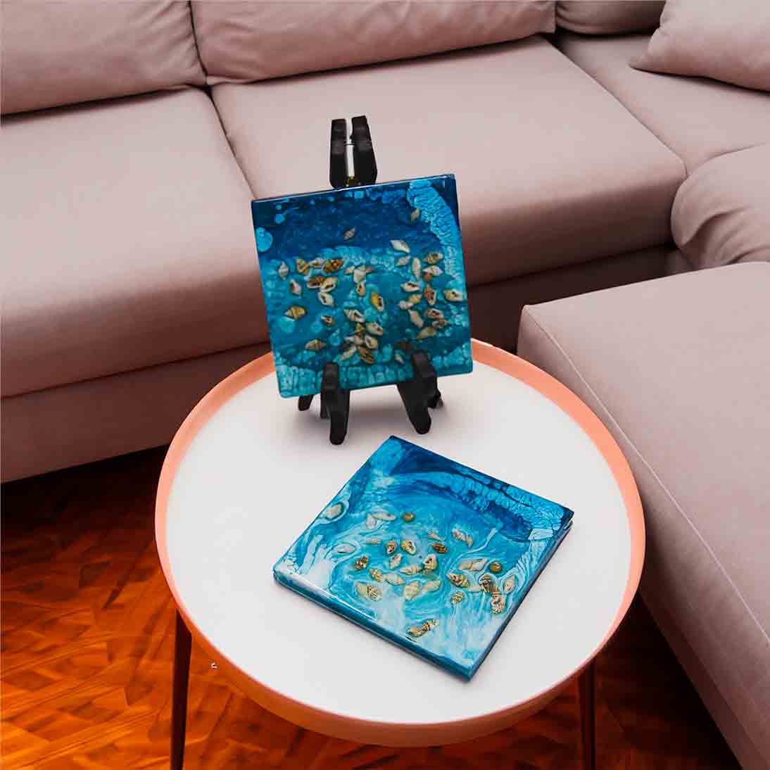 Four inch square resin coaster. Ocean themed with real shells embedded in the resin.