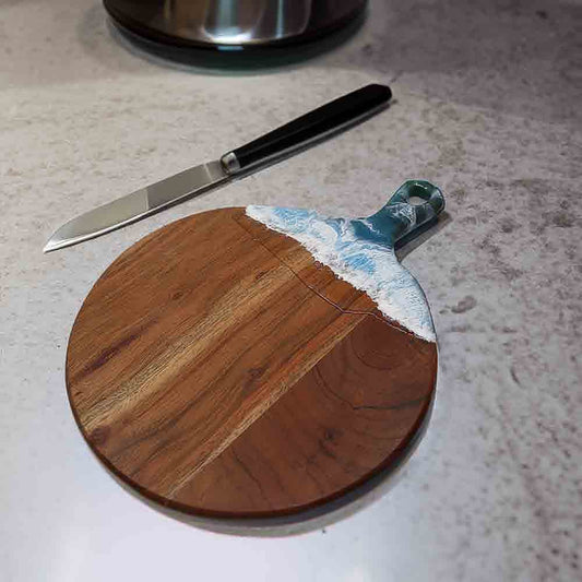 Ocean themed cheese board on kitchen counter. 