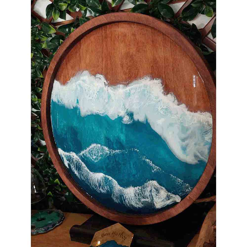 Ocean resin painting on a round wooden 20" board.