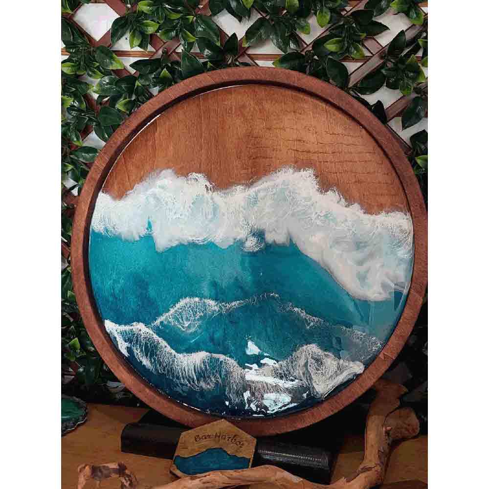 Ocean resin painting on a round wooden 20" board.